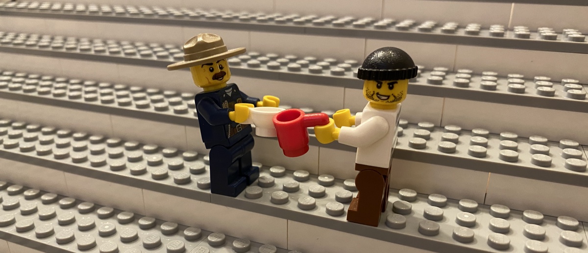 2 LEGO minifigures clinking cups