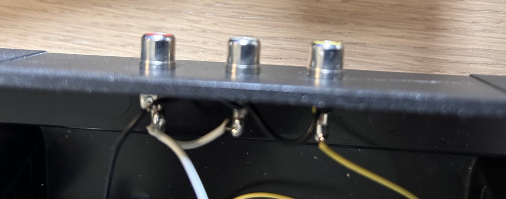 The RCA connectors attached to the case and wired up