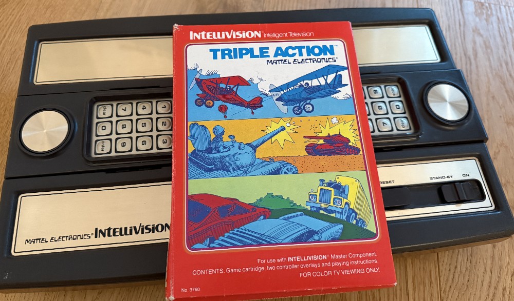 The Intellivision console with the Triple Action game box